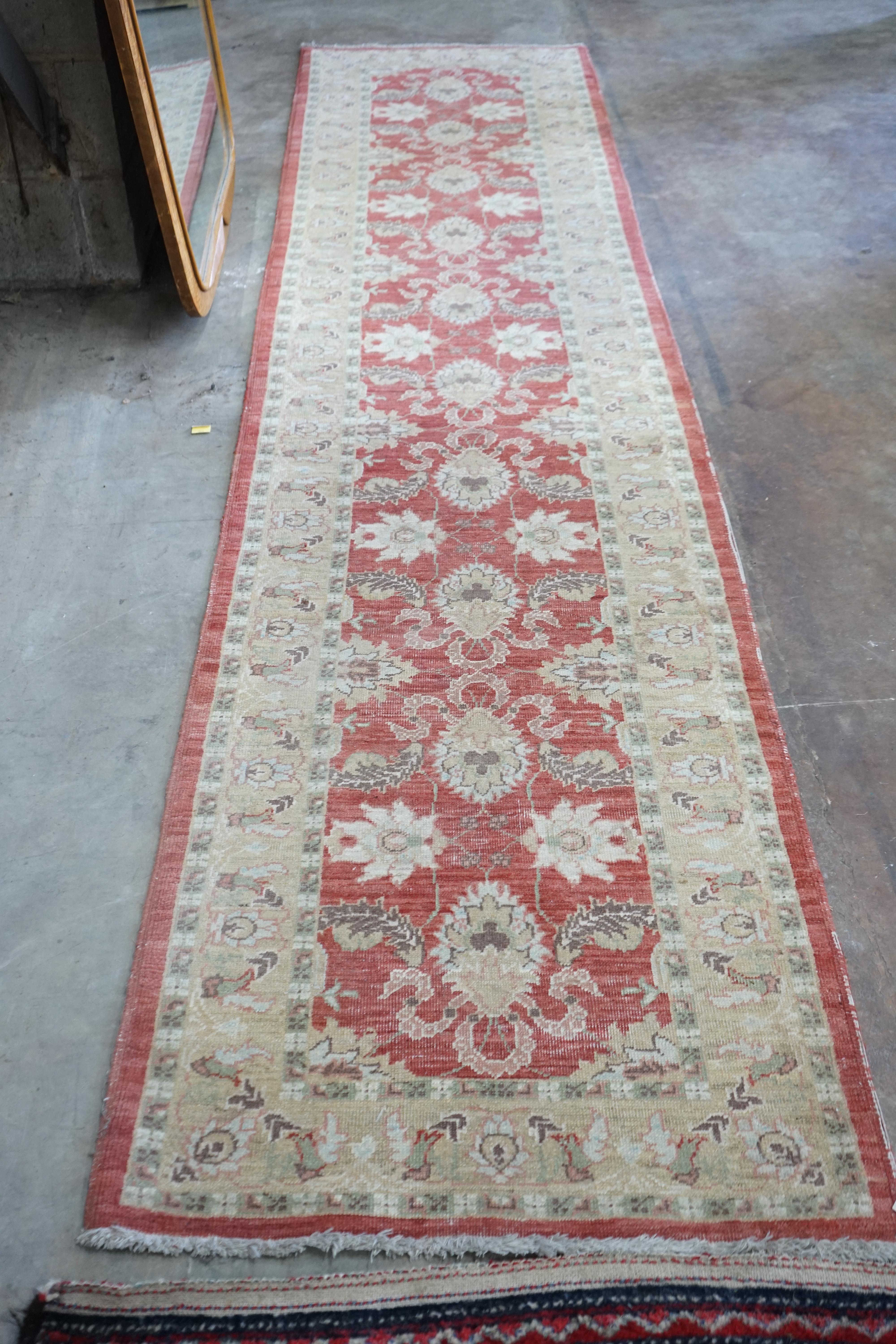 A Ziegler style red ground runner, 364 x 84cm